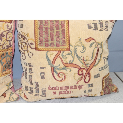 200 - Pair of large cushions decorated with illuminated style script, each approx 58cm square