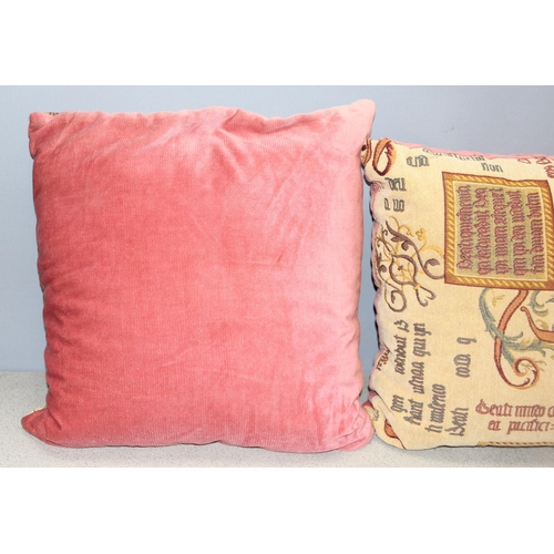 200 - Pair of large cushions decorated with illuminated style script, each approx 58cm square