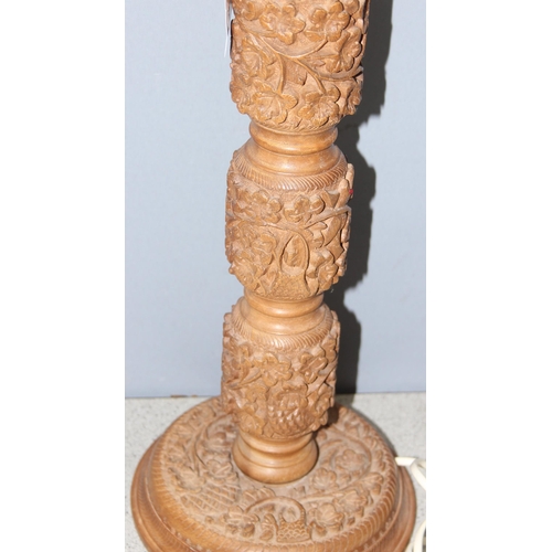 246 - Table lamp with carved foliage design wooden base and cream shade, approx 65cm H