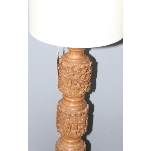 246 - Table lamp with carved foliage design wooden base and cream shade, approx 65cm H