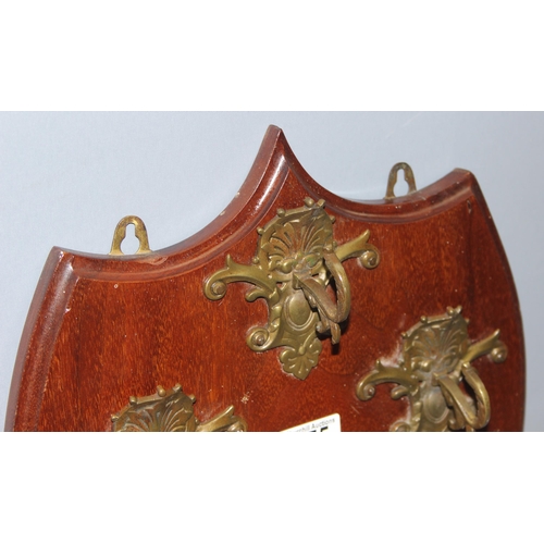 275 - 3 ornate coat hooks mounted on wooden shield, stamped on the back John Mason & Sons, approx 45cm x 3... 