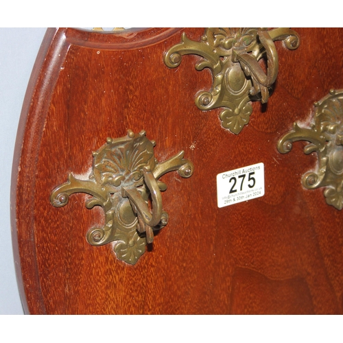 275 - 3 ornate coat hooks mounted on wooden shield, stamped on the back John Mason & Sons, approx 45cm x 3... 