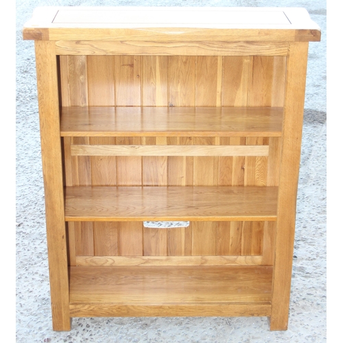 35 - A good quality modern light oak bookcase from Oak Furnitureland, approx 90cm wide x 30cm deep x 110c... 