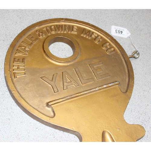 403 - Large cast aluminium Yale shop advertising hanging key sign, approx 78cm long