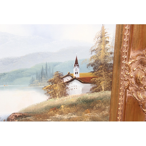 449 - 20th century oil on canvas of a landscape with lake and church, indistinctly signed, in highly decor... 