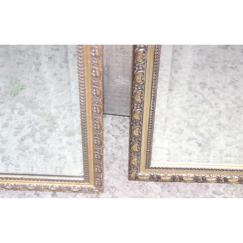 454 - 2 vintage ornate gilt framed hall mirrors, one approx 63cm x 94cm and the other approx 44cm x 128 cm