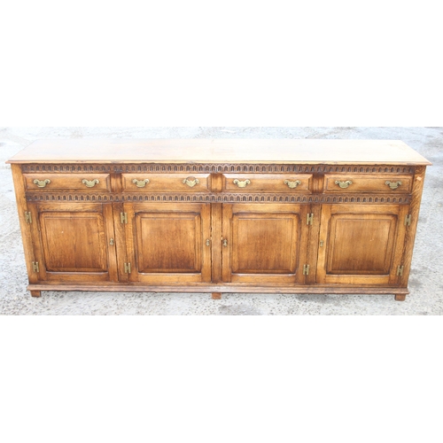 47 - A Georgian style oak sideboard, 4 drawers over 4 cupboards with 4 keys, approx 221cm wide x 51cm dee... 