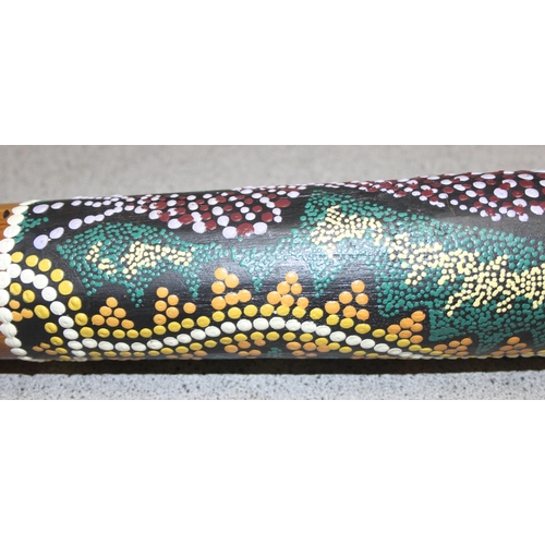 601 - Didgeridoo with aboriginal style painted decoration, approx 130cm