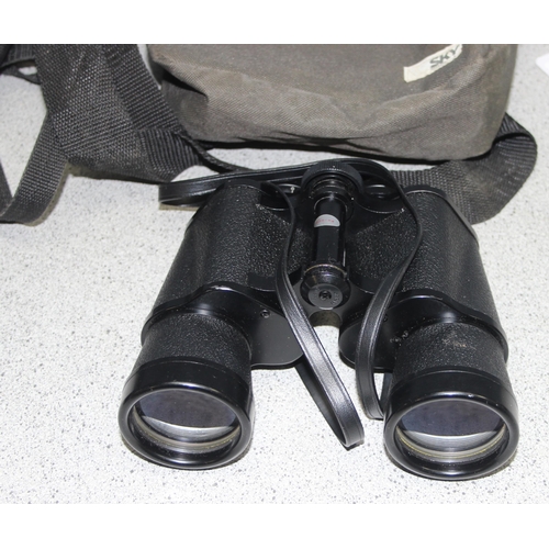 659 - 2 pairs of binoculars to incl Tasco model No. 312, and a Sunador Mega Zoom