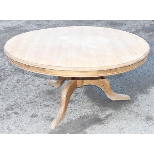 77 - A large Victorian style circular pine breakfast table, approx 151cm in diameter x 70cm tall