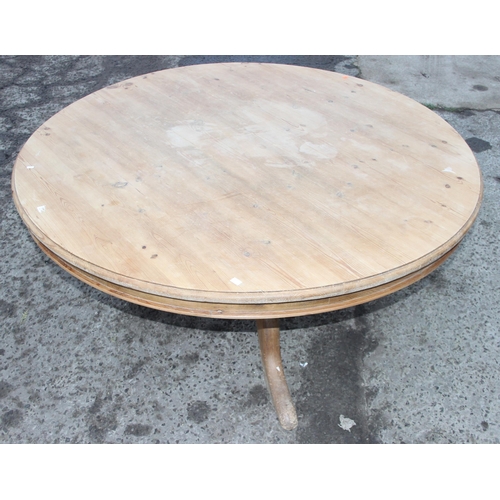 77 - A large Victorian style circular pine breakfast table, approx 151cm in diameter x 70cm tall