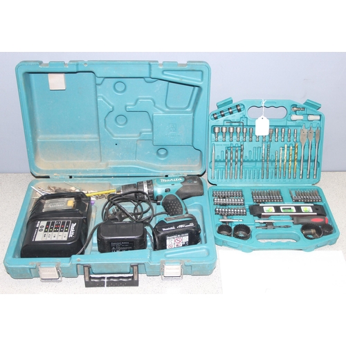 814 - Makita cordless drill with charger and 2 batteries, DHP453, and boxed drill bits and accessories