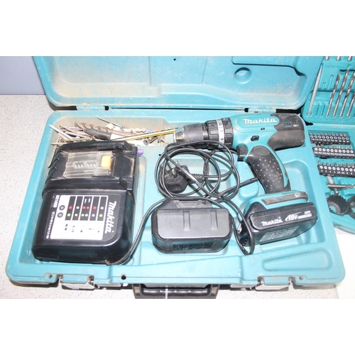 814 - Makita cordless drill with charger and 2 batteries, DHP453, and boxed drill bits and accessories