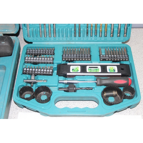 814 - Makita cordless drill with charger and 2 batteries, DHP453, and boxed drill bits and accessories