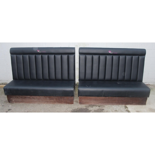 95 - A pair of black leatherette high backed wall benches or seats, previously part of an American style ... 