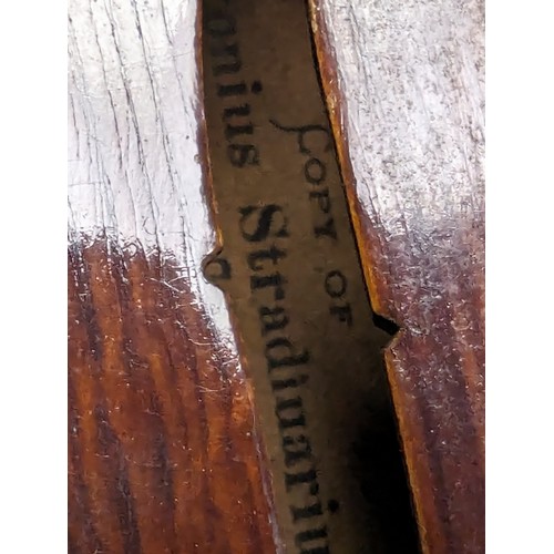 624 - A vintage violin in case, German made copy of a Stradivarius with label inside, first half 20th cent... 