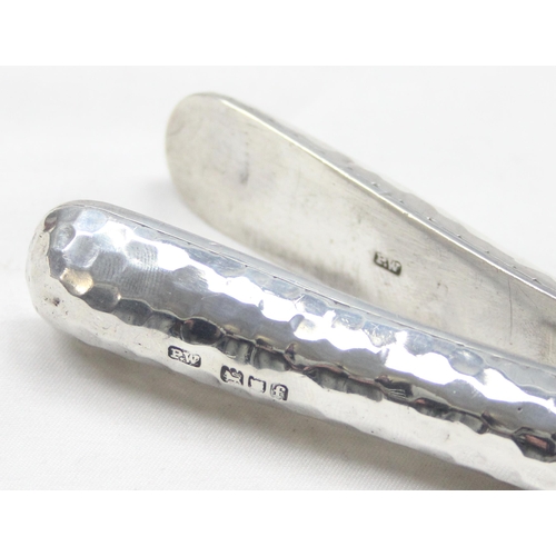 1002 - An unusual pair of Arts & Crafts period hammered silver glove stretchers, London 1901 by Percy White... 