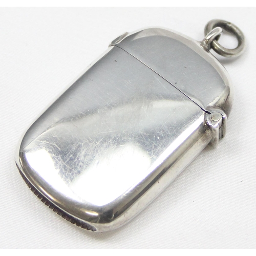 1034 - An antique silver vesta case of rounded form, Chester 1903 by William Neale, approx 18.69g gross