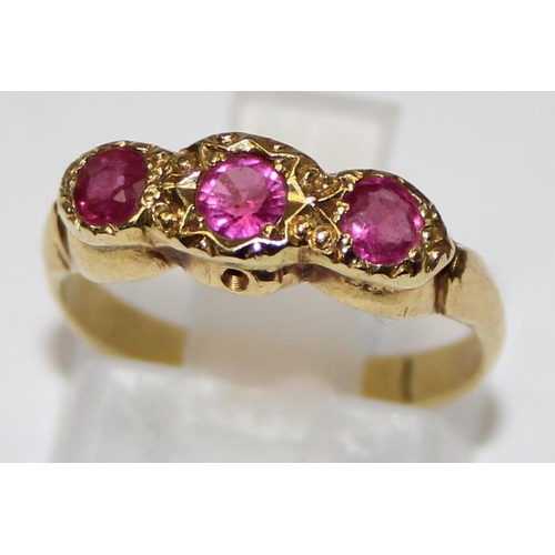 1106 - 18ct yellow gold and ruby set trilogy ring, marked 18ct and XRF confirmed, approx size J, approx 2.6... 