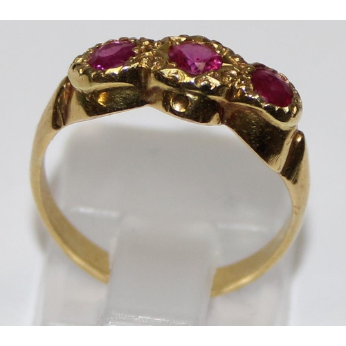 1106 - 18ct yellow gold and ruby set trilogy ring, marked 18ct and XRF confirmed, approx size J, approx 2.6... 