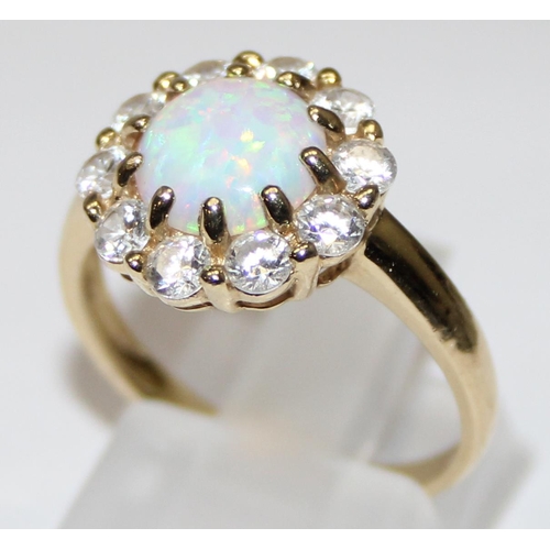 1110 - 14ct gold, white stone and opal set dress ring, full hallmarks and XRF tested, approx size P, approx... 