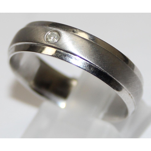 1124 - A retro style 9ct white gold and diamond set band ring, full hallmarks and XRF confirmed, approx siz... 