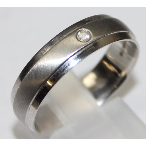 1124 - A retro style 9ct white gold and diamond set band ring, full hallmarks and XRF confirmed, approx siz... 