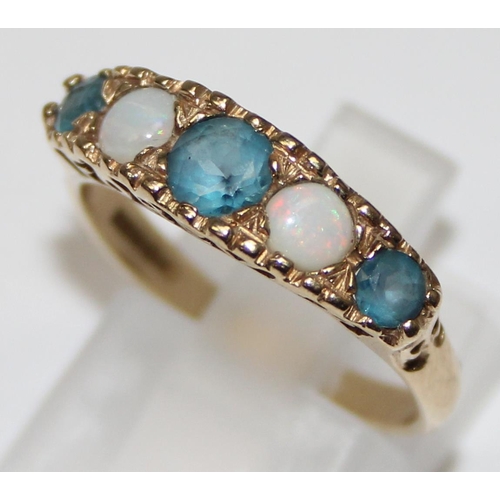 1133 - 9ct gold blue stone and opal ring, the setting with the word 