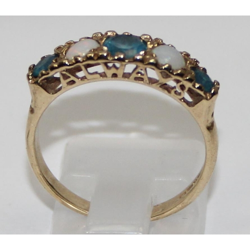 1133 - 9ct gold blue stone and opal ring, the setting with the word 