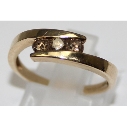 1134 - 9ct gold retro style crossover ring with a trio of diamonds, full hallmarks and XRF confirmed, appro... 