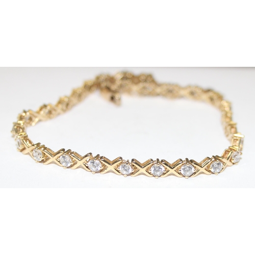 1141 - 9ct gold and white stone tennis bracelet, marked 375 & XRF confirmed, approx 20cm long, approx 8.93g... 