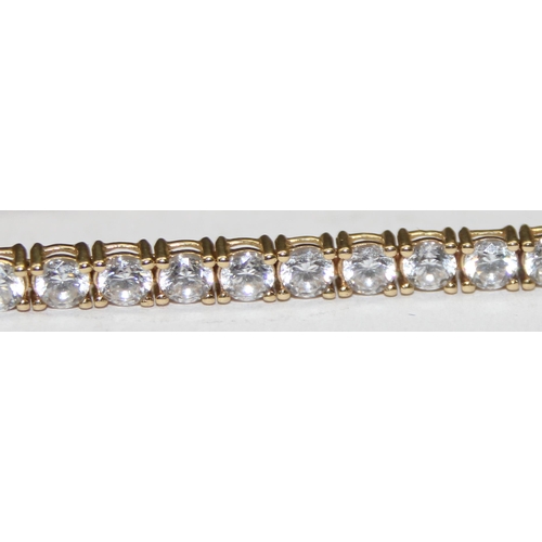 1142 - 9ct gold and white stone tennis bracelet, marked 375 & XRF confirmed, approx 20cm long, approx 9.21g... 