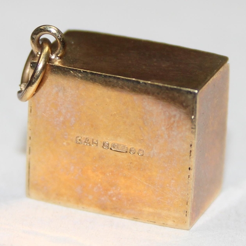 1144 - 9ct gold cased £1 note charm, fully marked and XRF confirmed, approx 2.86g gross