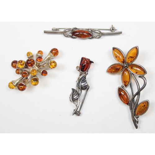 1163 - 4 silver and amber brooches of various designs, all XRF confirmed