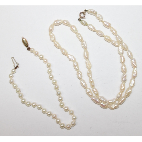 1169 - A baroque pearl necklace with 9ct gold clasp, a seed pearl and 9ct gold bracelet, and a faux pearl n... 