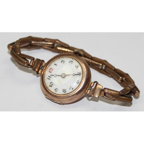 1311 - 9ct gold cased ladies watch on expanding gold plated strap, import marks for London, date letter rub... 