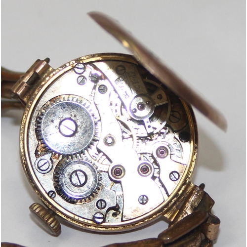 1311 - 9ct gold cased ladies watch on expanding gold plated strap, import marks for London, date letter rub... 