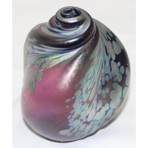 1658 - An Iridescent Art Glass paperweight formed as a sea shell, in the manner of Ditchfield & Okra, vario... 