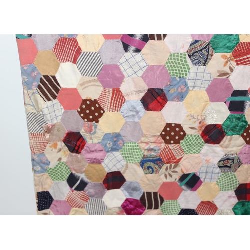 207A - A highly decorated colourful vintage patchwork quilt or blanket, likely early 20th century, approx 1... 