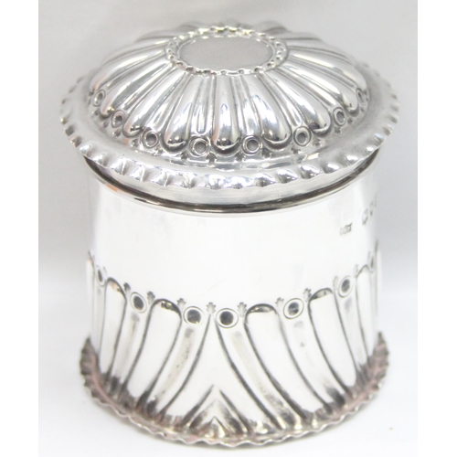 1046 - A Victorian embossed silver tea caddy, London 1893 by John Newton Mappin, approx 8cm tall, approx 96... 