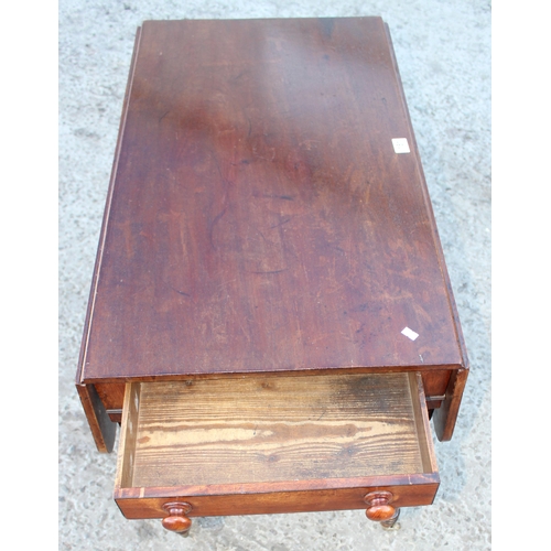 151 - An antique dropleaf mahogany table with turned legs, single drawer and brass castors, approx 102cm/ ... 
