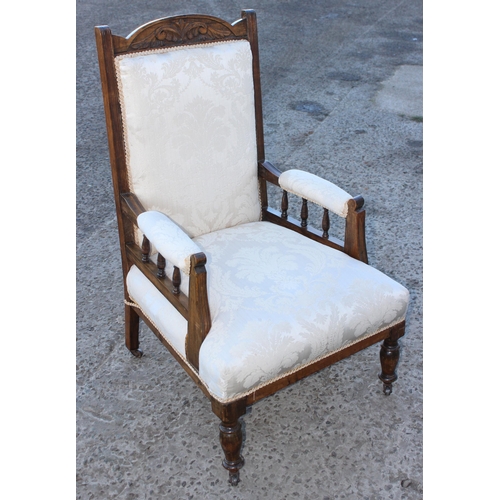 155 - A pair of antique cream upholstered low armchairs, the wooden frame with carved details, each approx... 