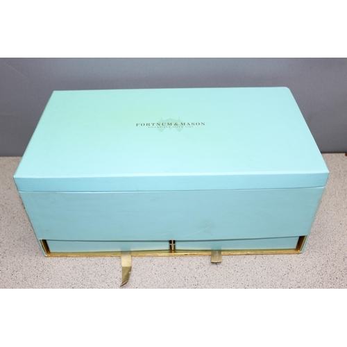 1675 - A bottle of Fortnum & Mason champagne in display box, 750ml