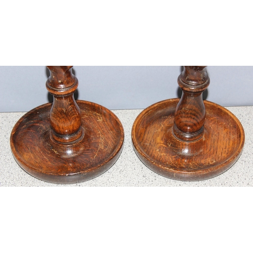 1792 - A pair early 20th century oak barleytwist candlesticks with copper sconses, each approx 32cm tall