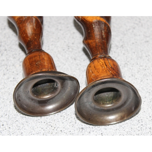 1792 - A pair early 20th century oak barleytwist candlesticks with copper sconses, each approx 32cm tall