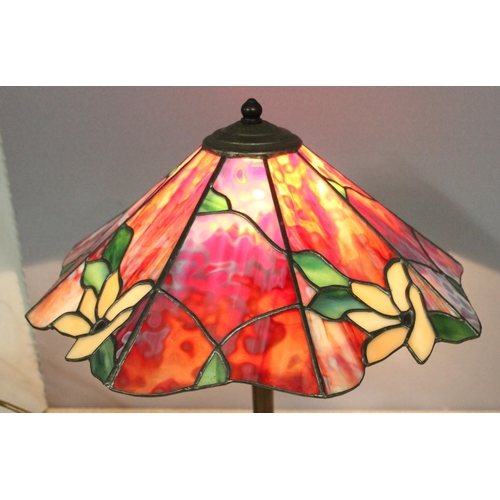 255 - A Tiffany style table lamp with leaded coloured glass shade and bronzed metal base, approx 43cm tall