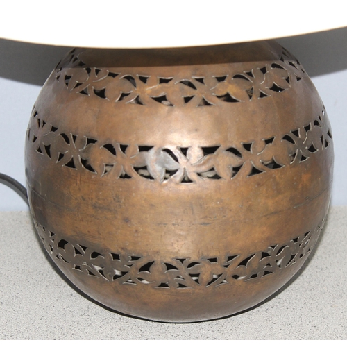 257 - African style pierced metal table lamp with shade, approx 49cm tall