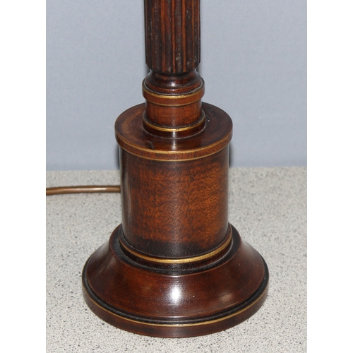 258 - An antique style turned wooden table lamp with gilt details, with shade, approx 65cm tall