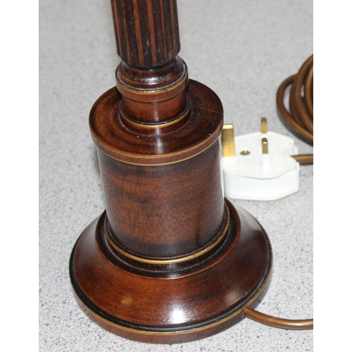 258 - An antique style turned wooden table lamp with gilt details, with shade, approx 65cm tall