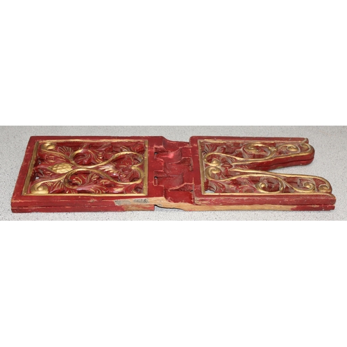 293 - A vintage red and gilt folding bookrest, possibly Chinese, approx 53cm wide when open